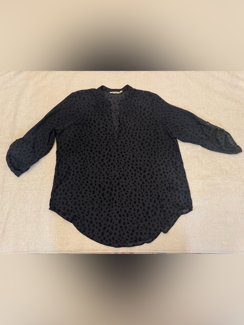 Lush V-neck blouse dark leopard print, 3/4 roll-tab sleeves.